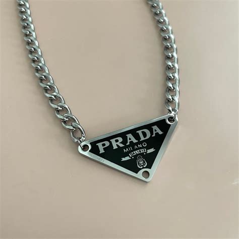 Prada necklace triangle .